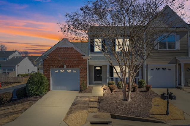 view of front of home with a garage and a porch