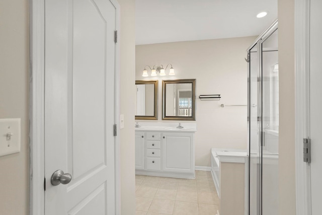 bathroom with tile patterned floors, independent shower and bath, and vanity