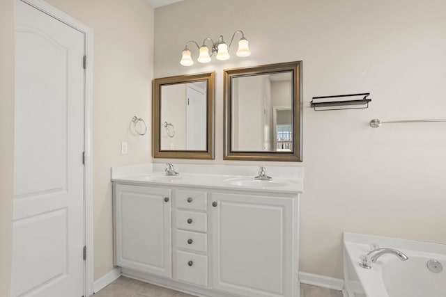 bathroom featuring a tub to relax in and vanity