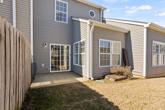 rear view of property featuring a patio area