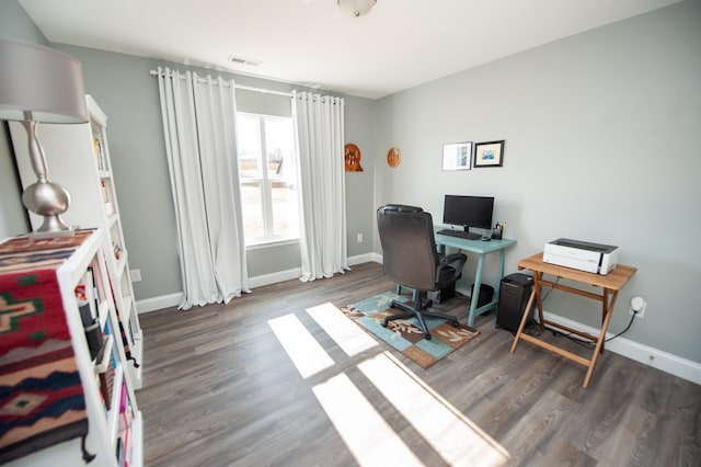 office space with dark wood-type flooring