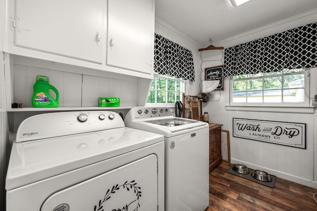 clothes washing area with cabinets, ornamental molding, dark hardwood / wood-style flooring, and washer and clothes dryer