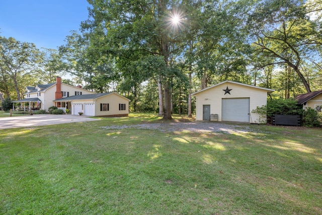 view of yard with an outbuilding and a garage