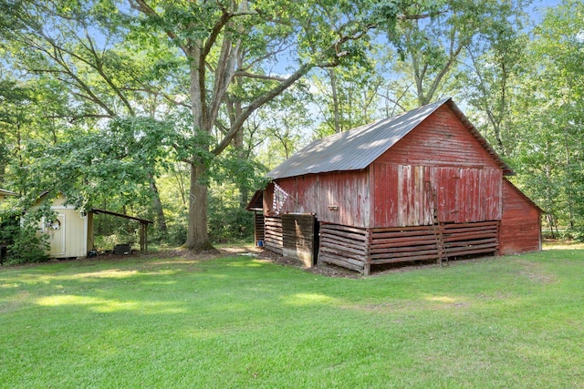 view of outdoor structure with a lawn