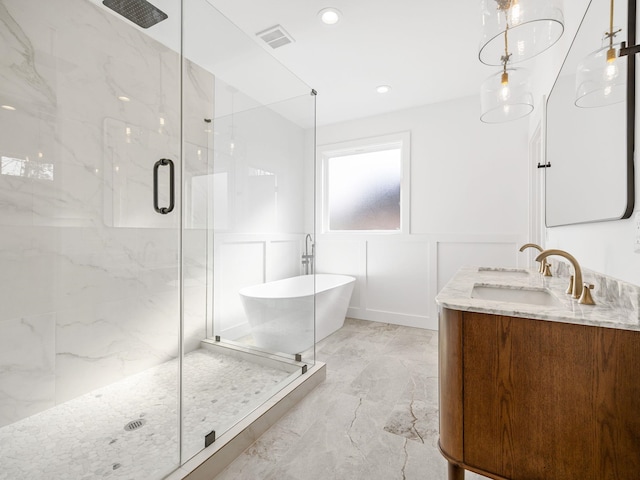 bathroom featuring vanity and plus walk in shower