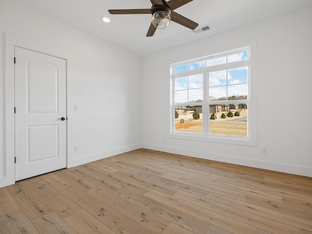 empty room featuring light hardwood / wood-style flooring and ceiling fan