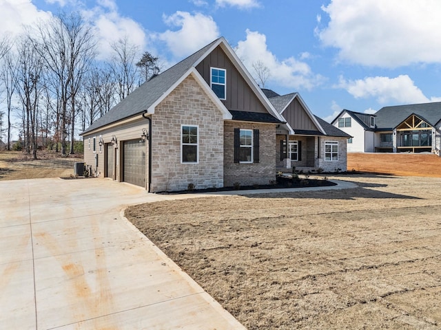 view of front of property with a garage and central air condition unit