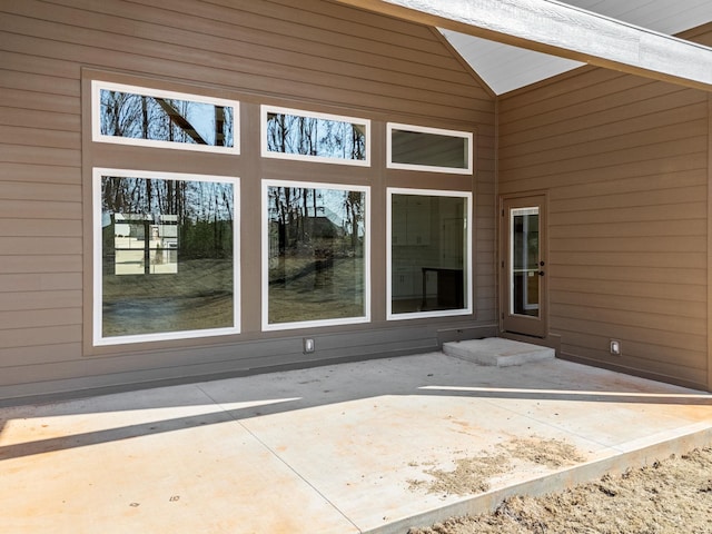 doorway to property featuring a patio