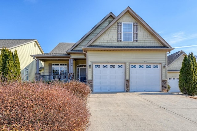 craftsman-style house with a garage and covered porch