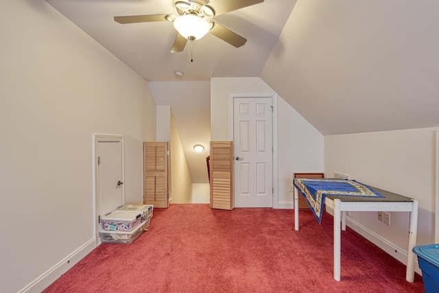 playroom with ceiling fan, lofted ceiling, and carpet flooring