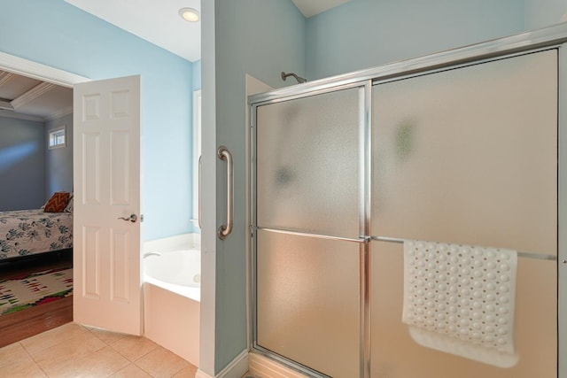 bathroom featuring tile patterned flooring, shower with separate bathtub, and ornamental molding