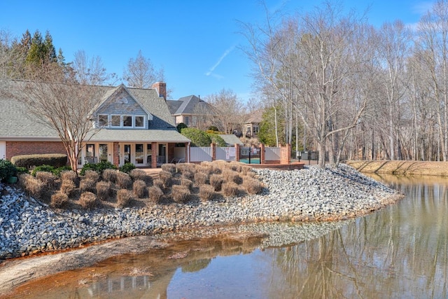 exterior space with a water view