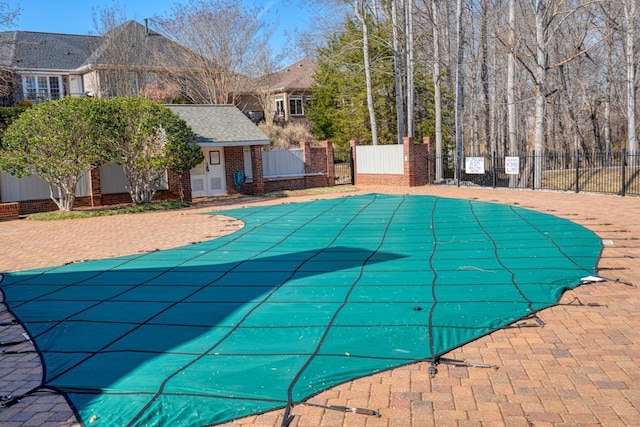 view of swimming pool with a patio area