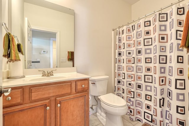 bathroom with tile patterned flooring, vanity, curtained shower, and toilet