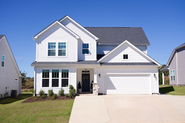 view of front of property featuring central AC unit, a garage, and a front yard