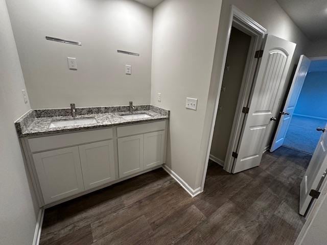 bathroom with vanity and hardwood / wood-style flooring