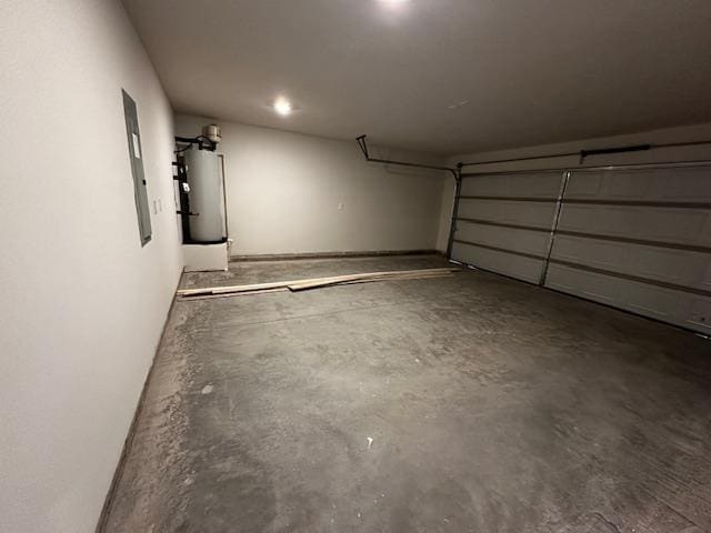 garage with gas water heater and electric panel