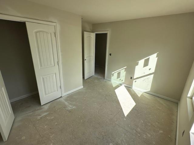 unfurnished bedroom with a closet