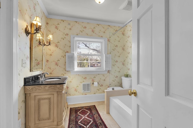 bathroom featuring crown molding, vanity, tile patterned floors, toilet, and a bathing tub