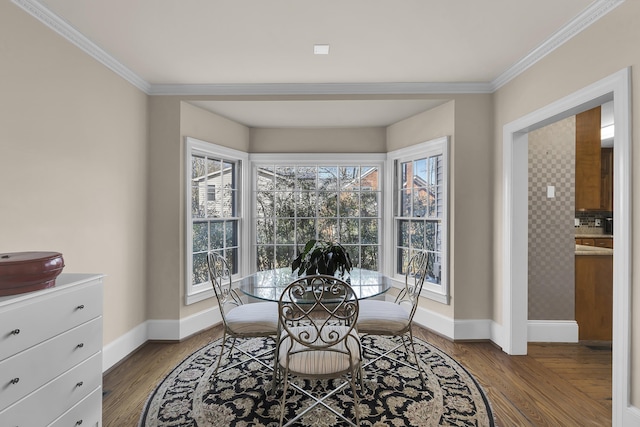 dining room featuring hardwood / wood-style flooring and ornamental molding