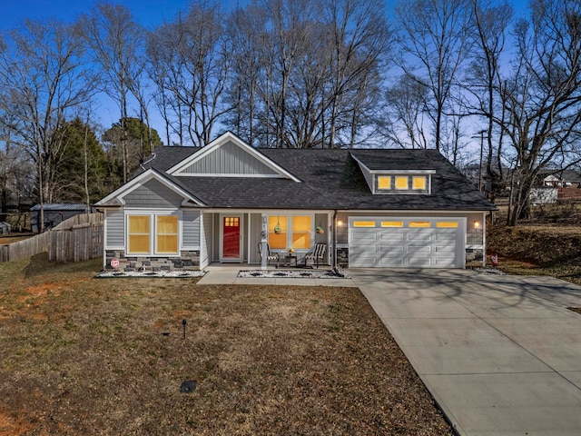 view of front of house with a garage and a front yard