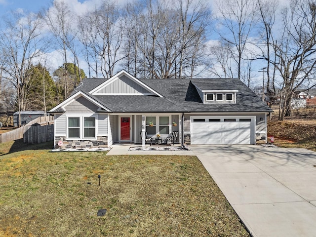 view of front of home featuring a garage and a front yard