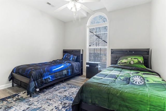 bedroom with hardwood / wood-style flooring and ceiling fan