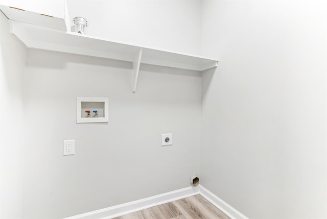 laundry area with washer hookup, light hardwood / wood-style floors, and hookup for an electric dryer