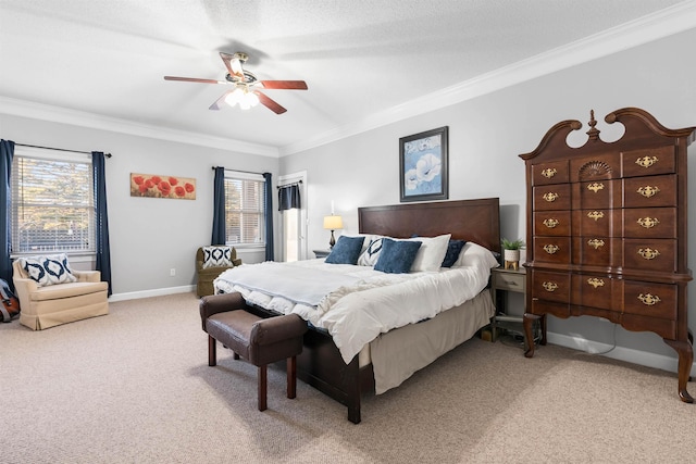 carpeted bedroom featuring crown molding and ceiling fan