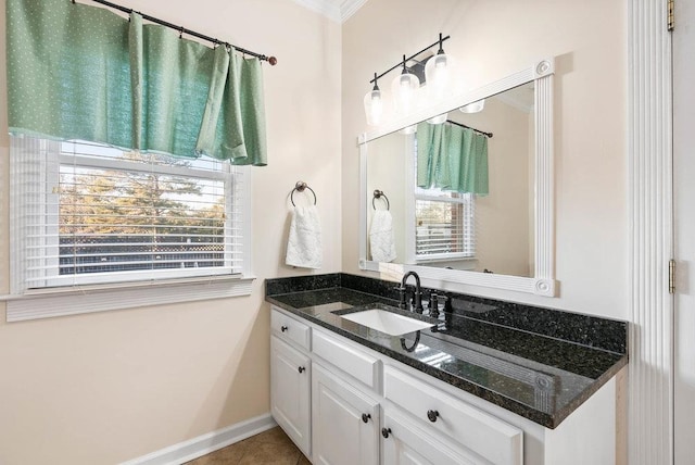 bathroom with tile patterned flooring, vanity, and crown molding