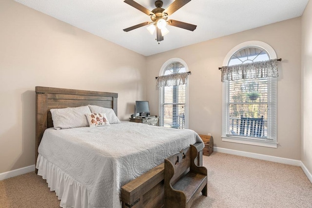 bedroom with light carpet and ceiling fan