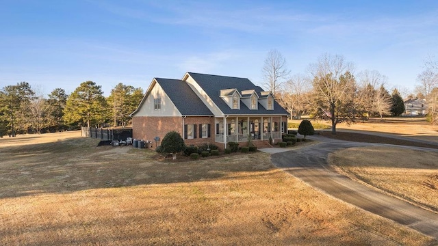 view of front of home with a front lawn and covered porch