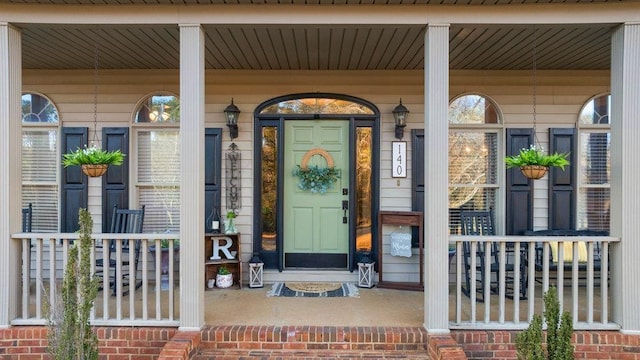 property entrance featuring covered porch