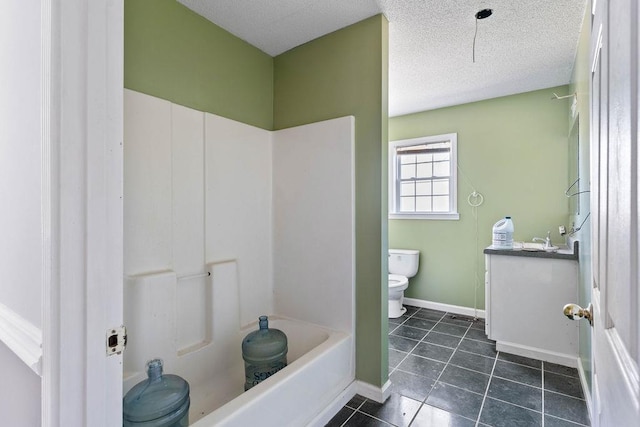 full bathroom with shower / bathing tub combination, vanity, toilet, tile patterned floors, and a textured ceiling