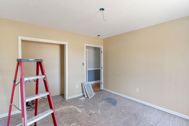 unfurnished bedroom with a textured ceiling