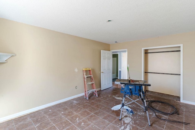 interior space featuring a textured ceiling