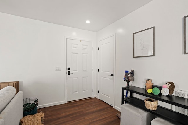 foyer entrance featuring dark hardwood / wood-style floors