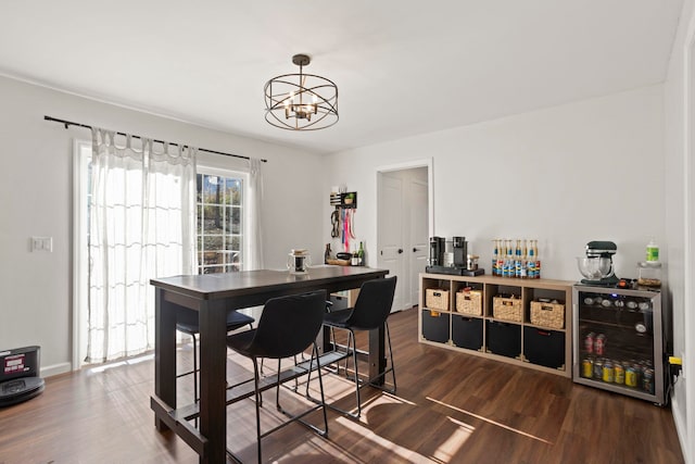 dining room featuring dark wood-type flooring and a chandelier