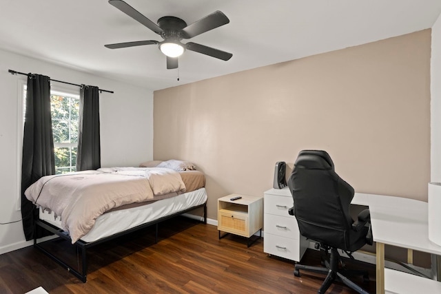 bedroom with dark wood-type flooring and ceiling fan