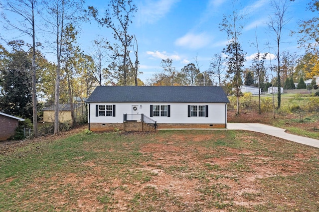 ranch-style home with a front lawn