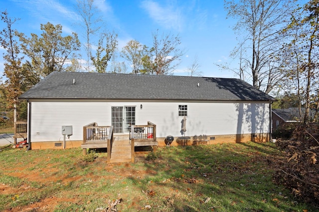 back of house with a yard and a deck