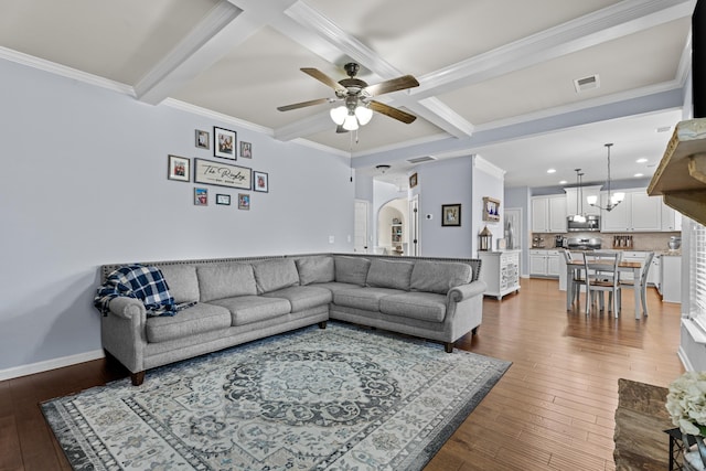 living room featuring beamed ceiling, crown molding, coffered ceiling, and hardwood / wood-style floors