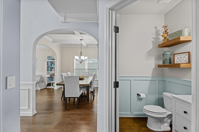 bathroom featuring beamed ceiling, wood-type flooring, coffered ceiling, and vanity