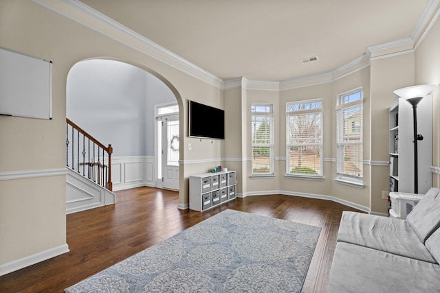 living room with dark hardwood / wood-style flooring and ornamental molding