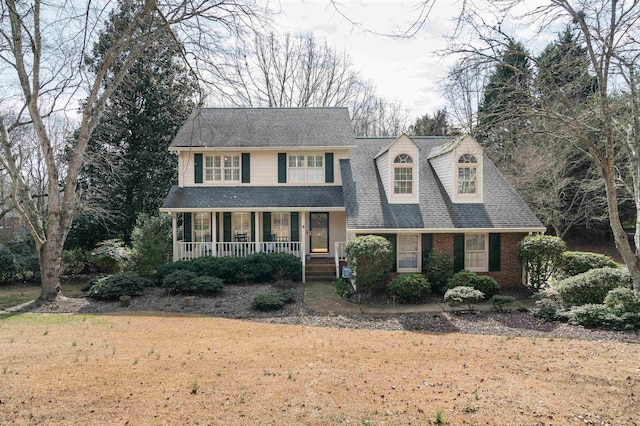 view of front of home with a front lawn and a porch