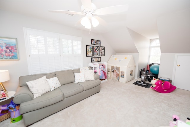 living room featuring light carpet, vaulted ceiling, and ceiling fan