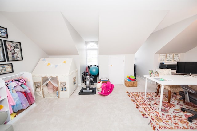 playroom with vaulted ceiling and carpet