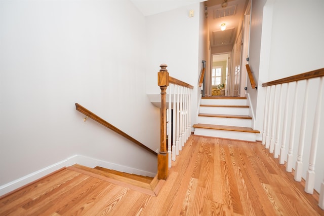 stairway featuring hardwood / wood-style flooring