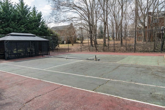 view of tennis court featuring a gazebo