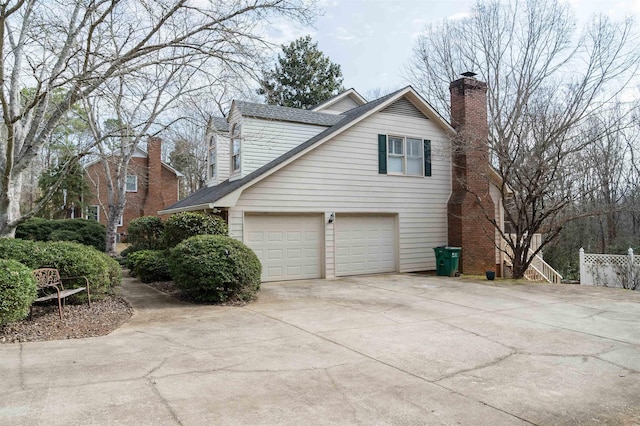 view of side of property featuring a garage